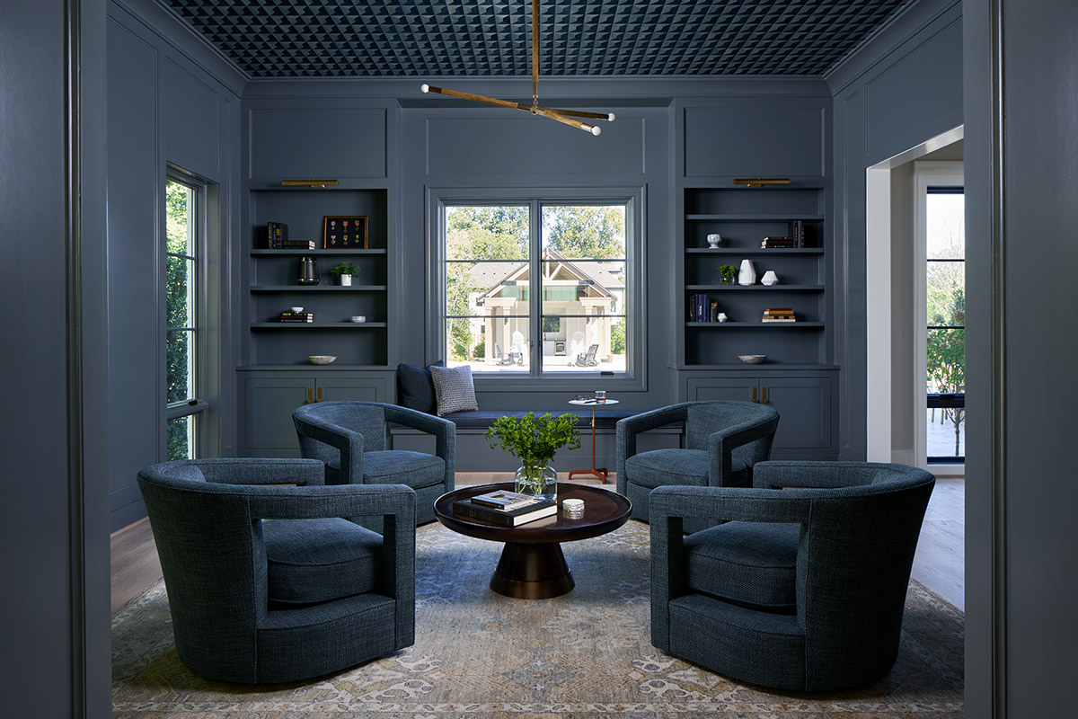 blue sitting room with blue shelves and chairs
