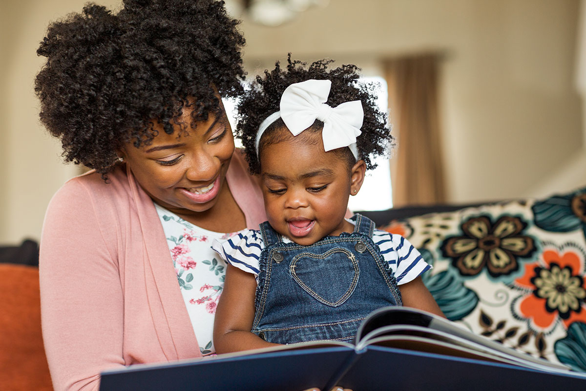mom and baby reading book