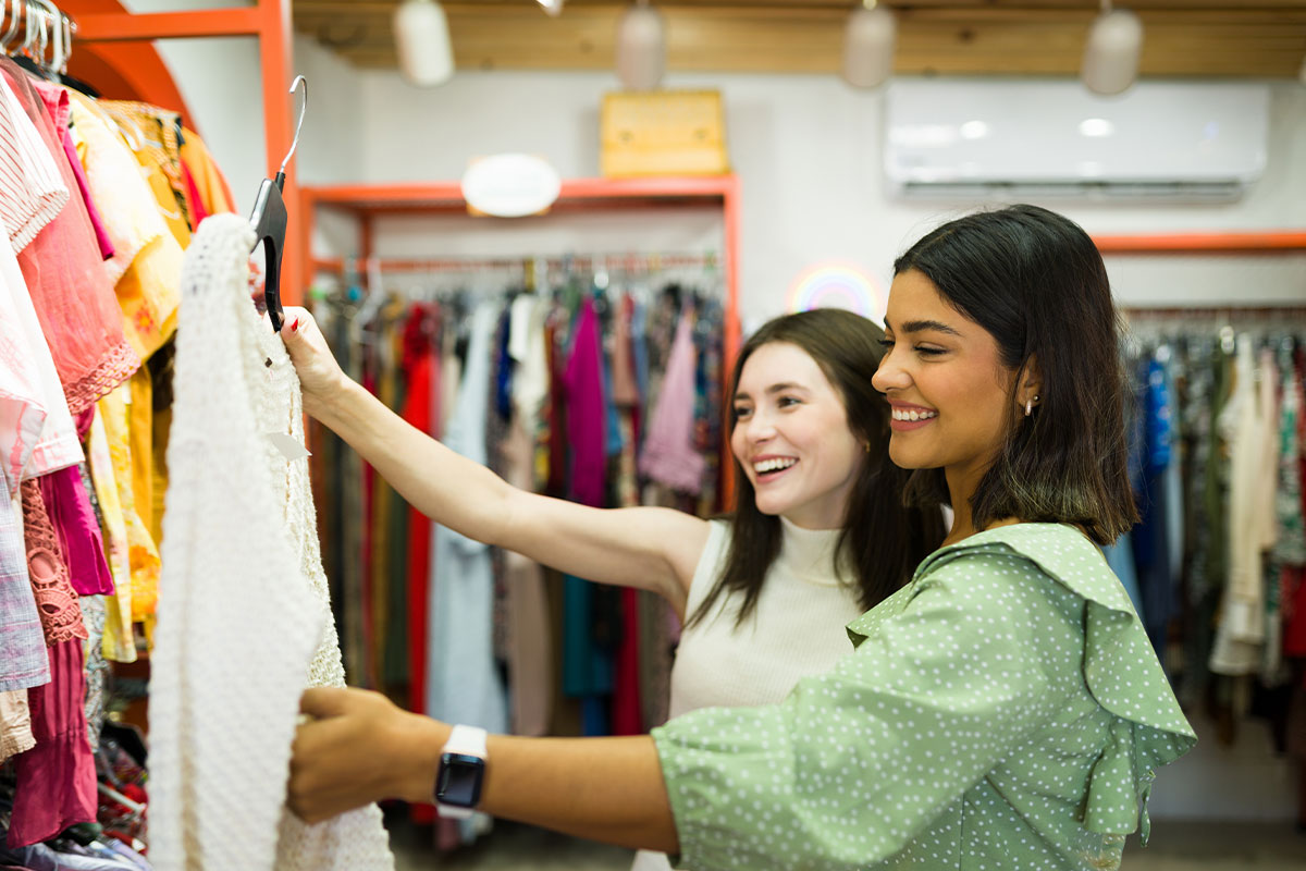 Girls shopping at consignment store