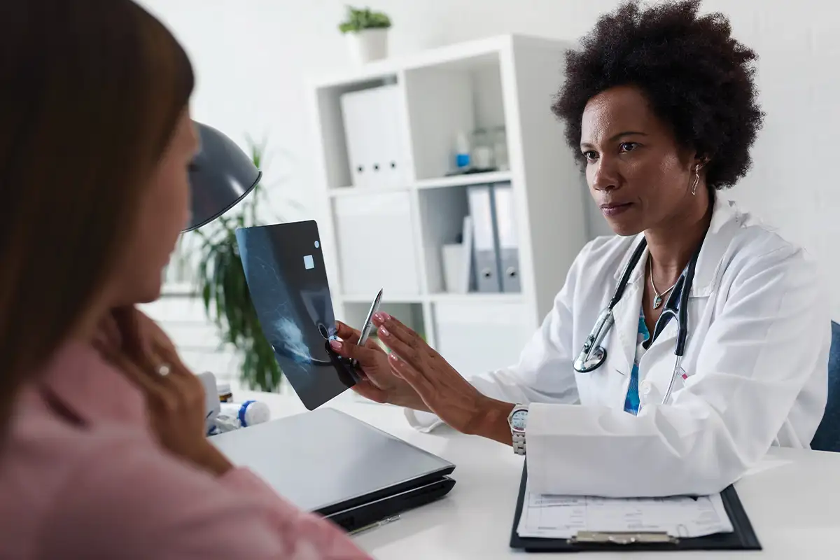 Woman speaking with doctor about breast cancer risk
