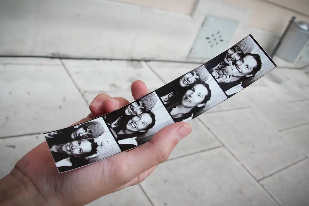 A black-and-white photo booth strip