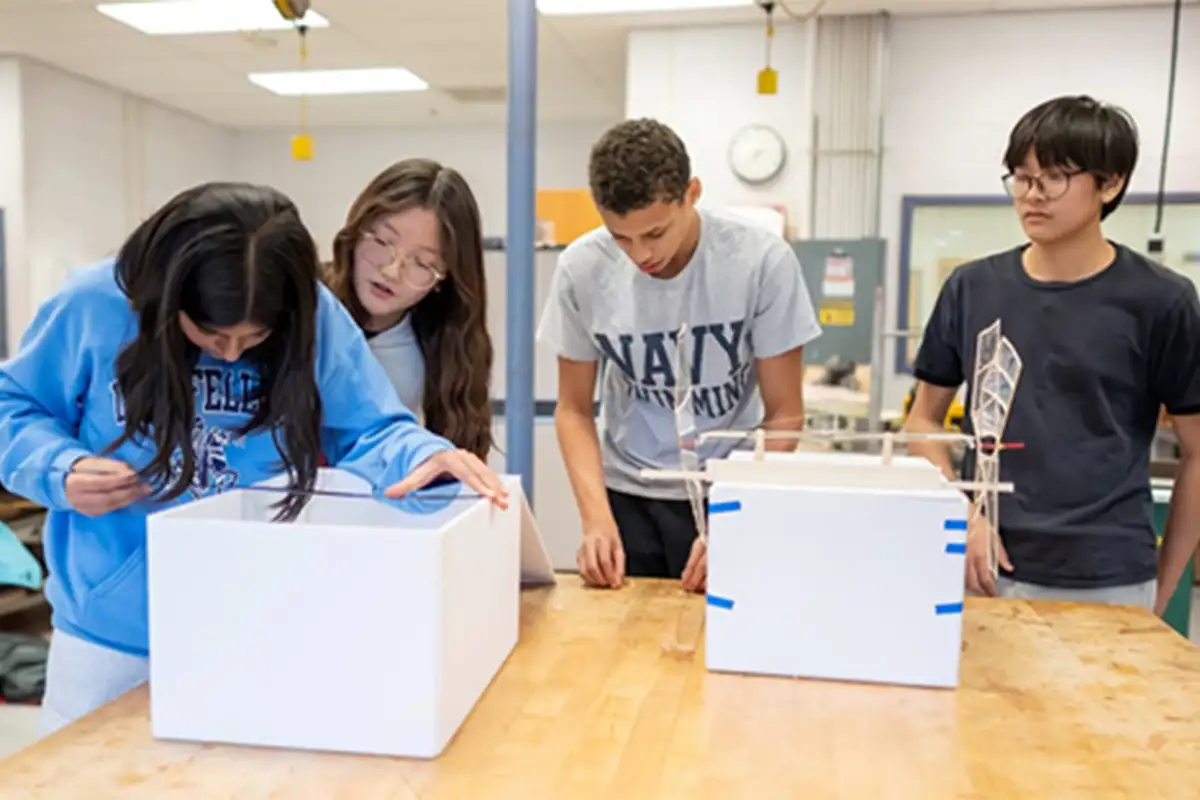students at Longfellow Middle School’s Science Olympiad team work on their project
