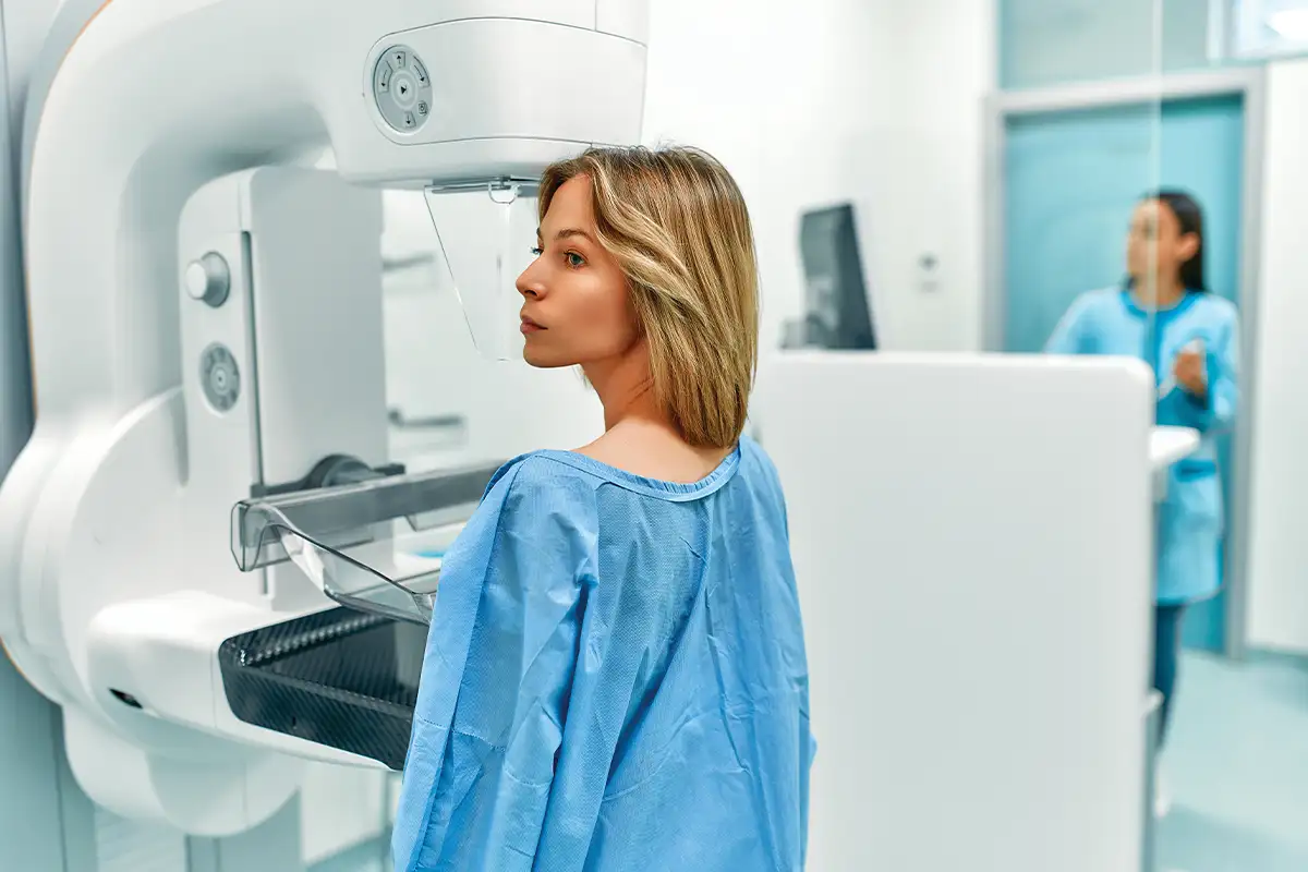 Woman at doctor's office receiving breast cancer screening