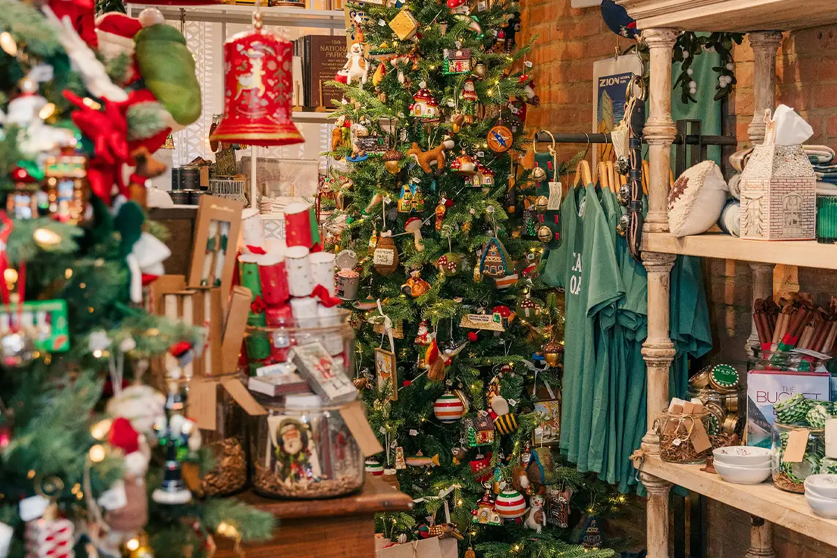 a Christmas tree and holiday merchandise at Red Barn Mercantile