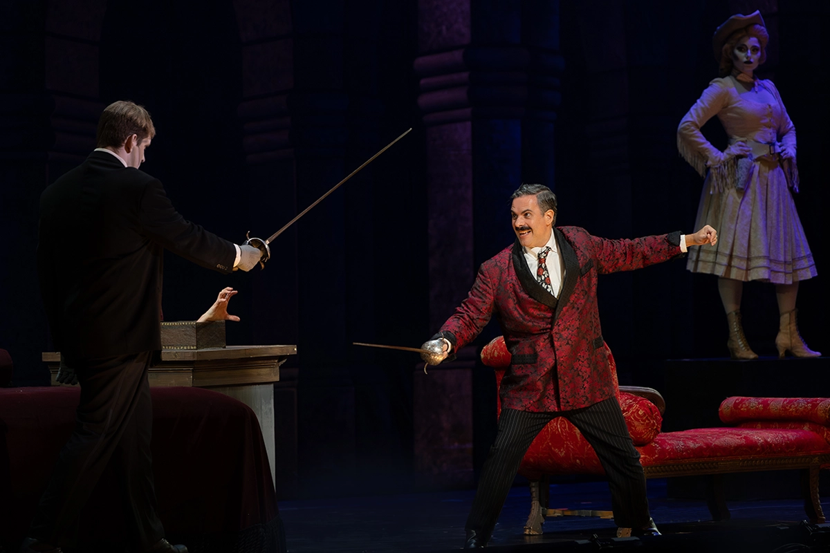 a guy fighting off with a sword in The Addams Family